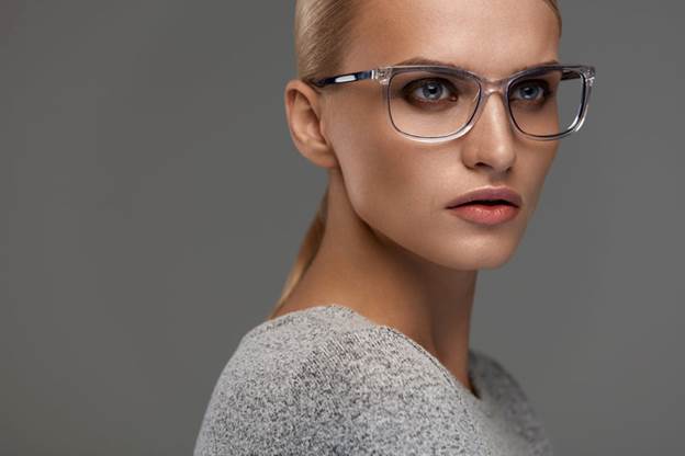 A woman wearing glasses with clear frames.